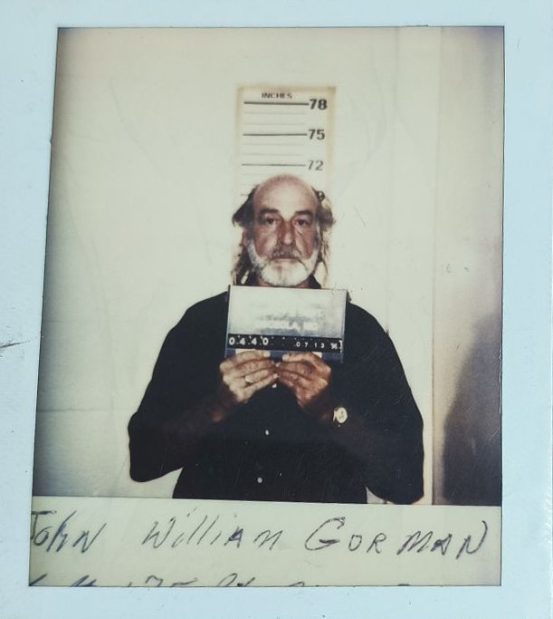 Booking photograph of Jo Bob Sackett, Ponder County Sheriff's Dept., 12-02-1995. Fiction.