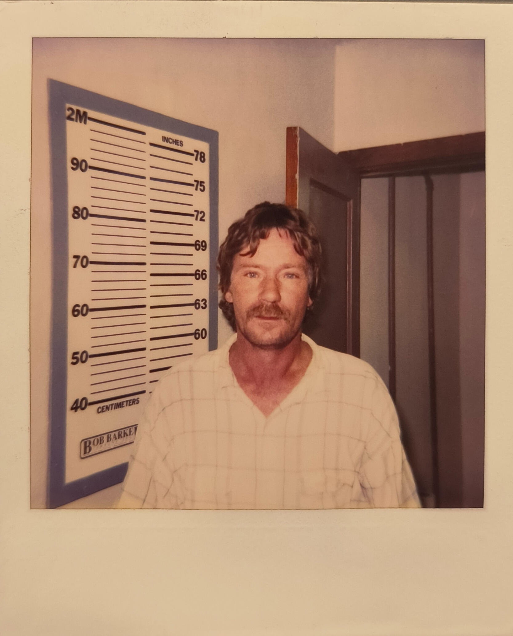 Booking photograph of Buck McGraw, Ponder County Sheriff's Dept., 12-02-1995. Fiction.